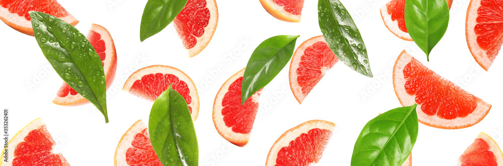 Slices of juicy grapefruit and leaves on white background. Banner design Slices of juicy grapefruit and leaves on white background. Banner design