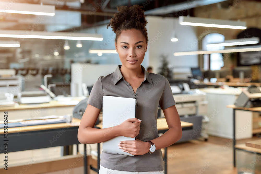 Obraz premium Take a lead and make it happen. Attractive african american worker standing in office