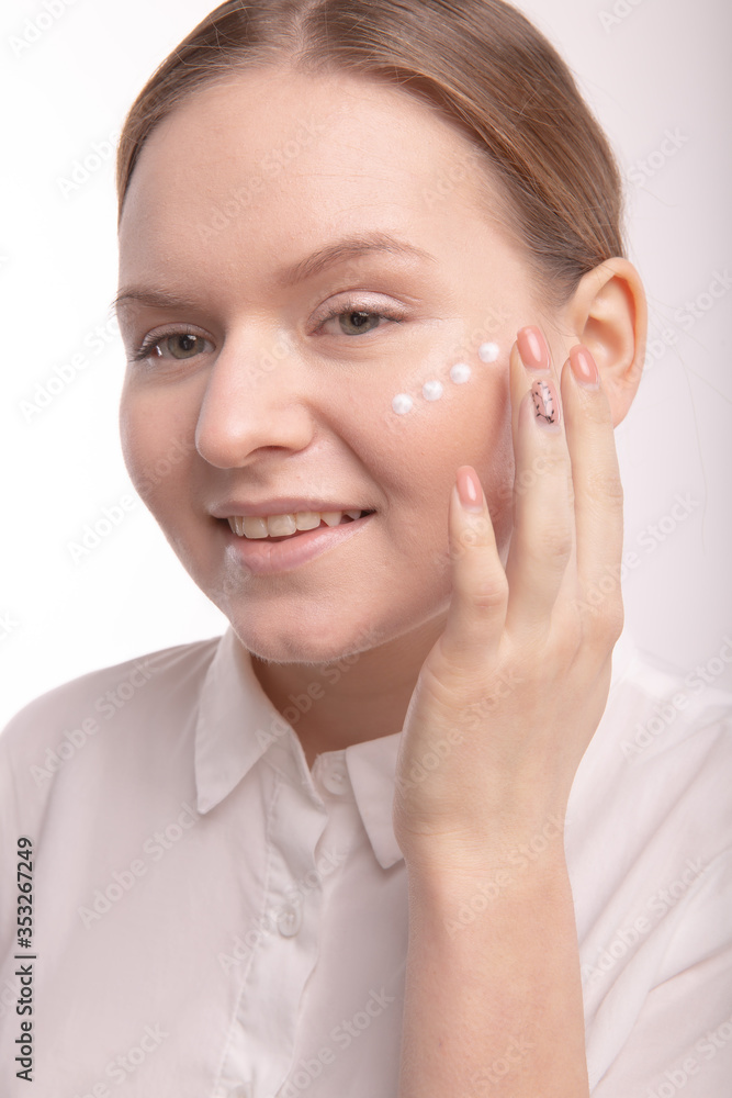Closeup of girl with face cream. The correct application of the cream. Closeup of girl with face cream. The correct application of the cream.