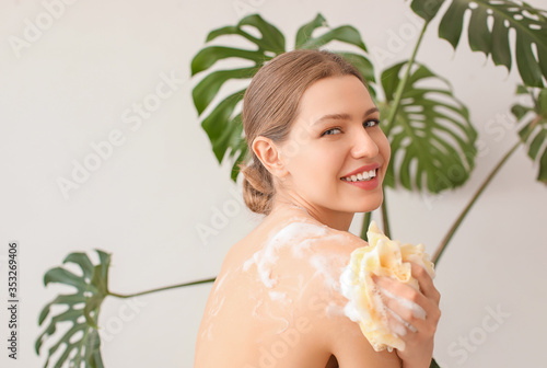 Beautiful young woman takin...