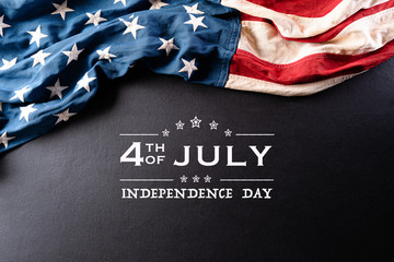 Happy Independence Day. American flags against a black  background. July 4.