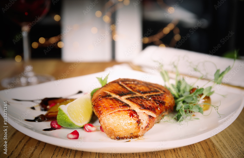 Delicious grilled duck breast served on wooden table indoors, closeup. Food photography Delicious grilled duck breast served on wooden table indoors, closeup. Food photography