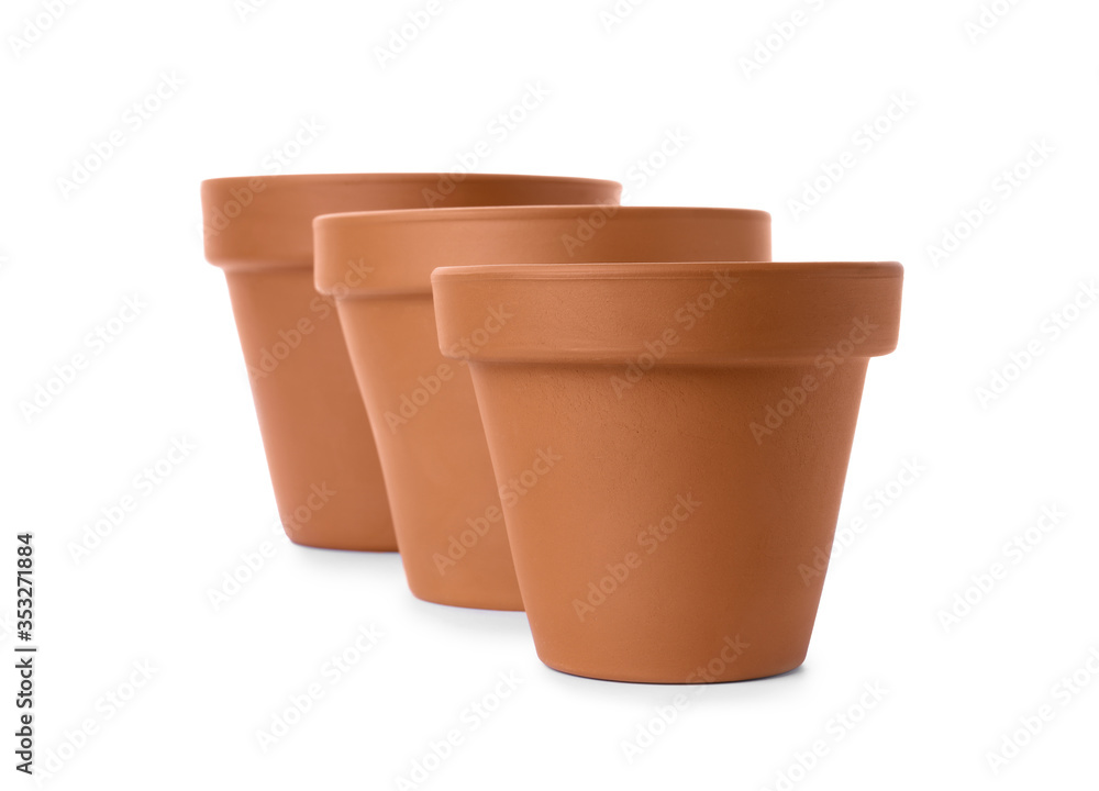 Stylish terracotta flower pots isolated on white Stylish terracotta flower pots isolated on white