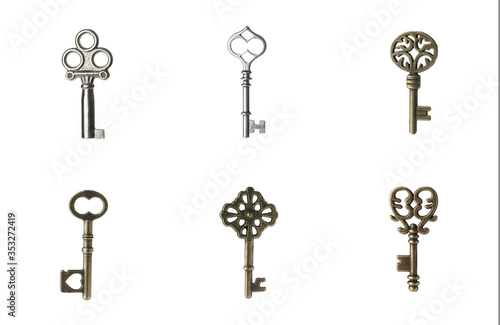 Set of different ornate keys on white background