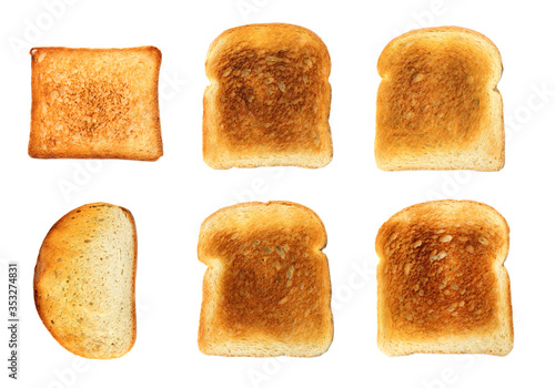 Set with toasted slices of wheat bread on white background, top view