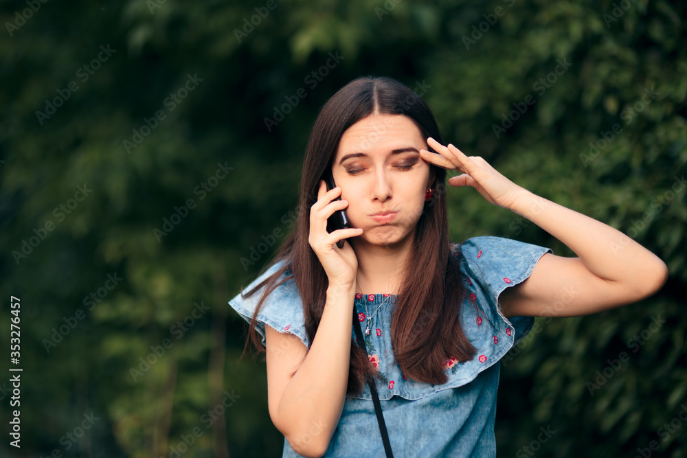 Worried Woman Talking At the Phone Outdoors