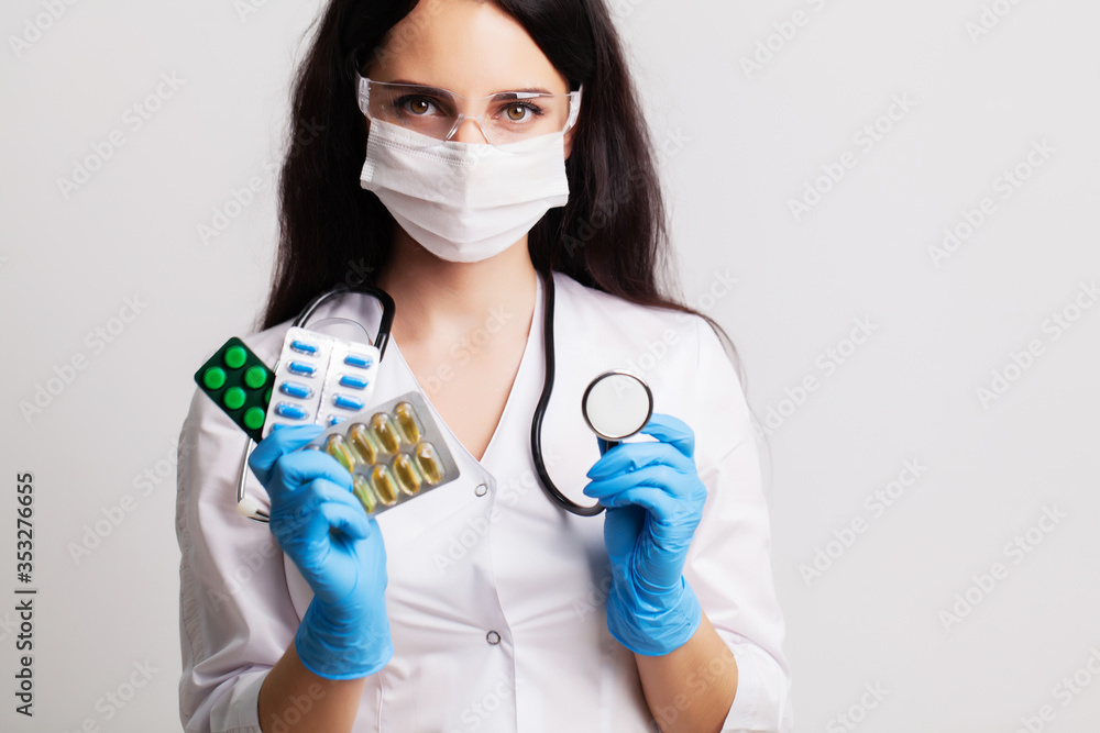Medicine concept, female doctor holding pills prescribed for patient treatment