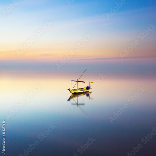 fishing boat at sunrise