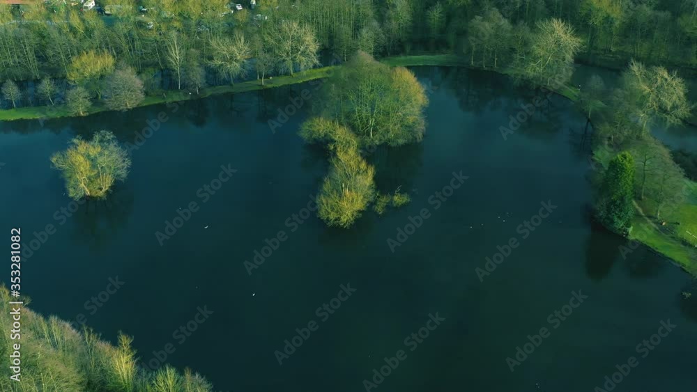 Beautiful aerial view of a lake with birds flying, wild nature, water. Beautiful aerial view of a lake with birds flying, wild nature, water.