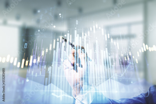 Wallpaper Mural Multi exposure of businessman hand with pen working with virtual creative financial chart hologram on blurred office background, research and analytics concept Torontodigital.ca