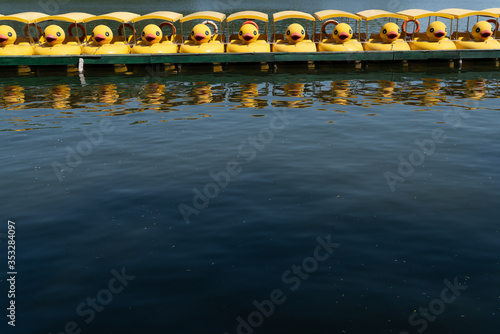 Yellow duck pedal boat row in Beihai park, Beijing, China.