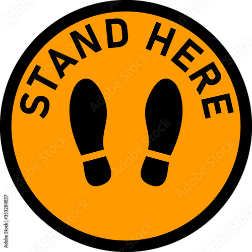 Stand Here Round Floor Marking Sticker Icon with Text and Shoeprints for Queue Line or Other Purposes Requiring Social Distancing. Vector Image.
