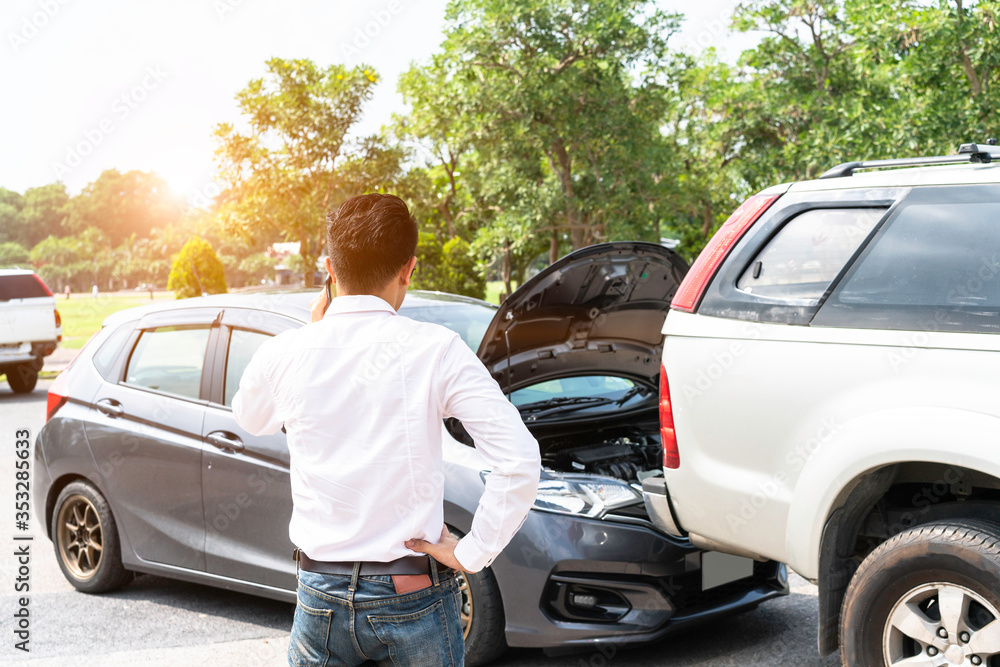 Businessman using smart phone and call the car insurance After traffic Accident Businessman using smart phone and call the car insurance After traffic Accident