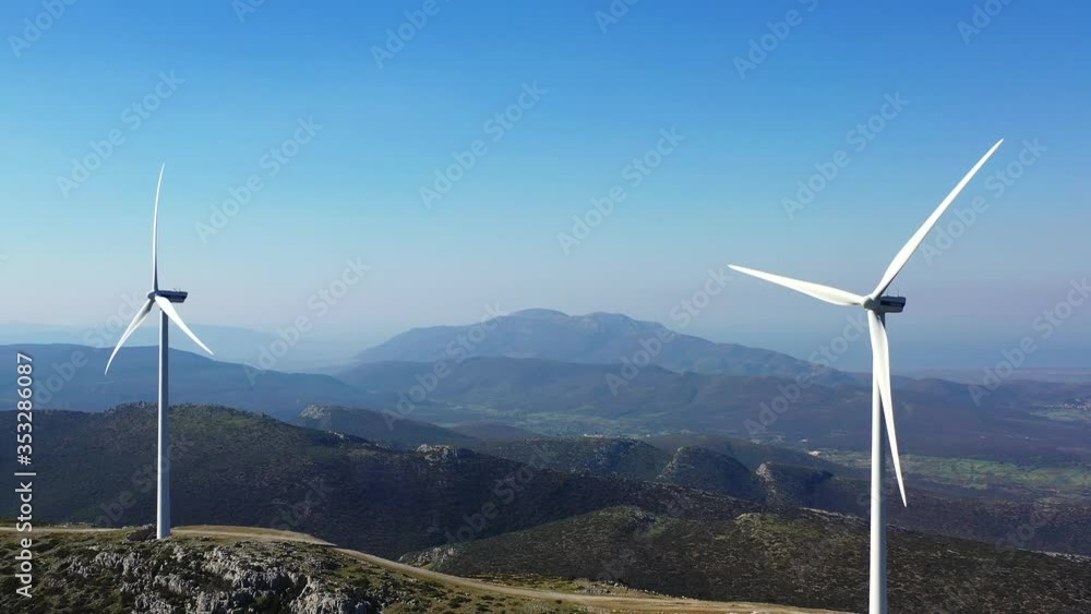 Windmill farm in Greece. Wind energy on mountains view 4k footage Windmill farm in Greece. Wind energy on mountains view 4k footage