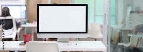 Wallpaper Mural Close up view of office desk with blank screen computer and coffee mug Torontodigital.ca