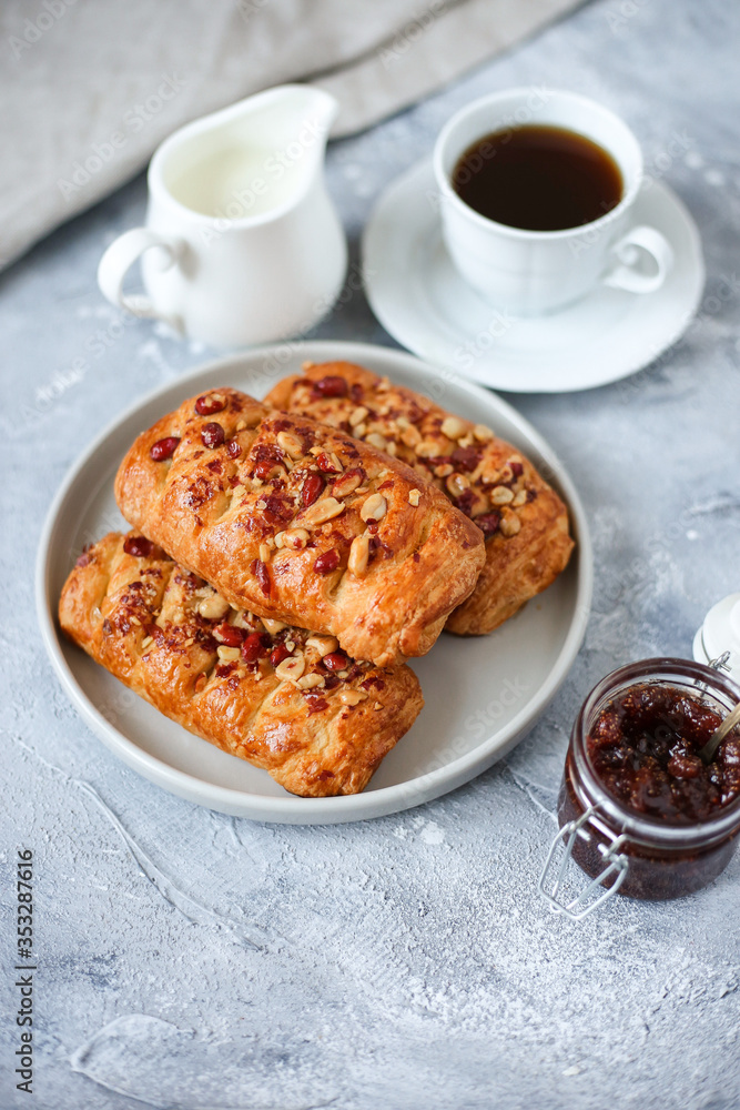 walnut puffs with a cup of coffee and strawberry jam walnut puffs with a cup of coffee and strawberry jam