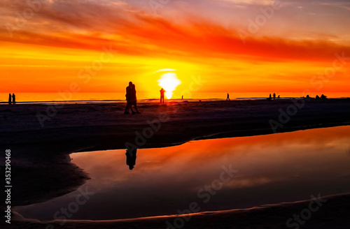 sunset over the water, sea, beach, red, sky, orange, yellow, reflection, horizon, sun, Lido Beach, Florida
