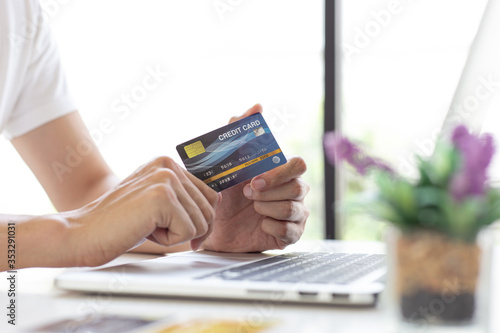 Men use smart phone to register online purchases using credit card payments, Convenience in the world of technology and the internet, Shopping online and banking online concept.