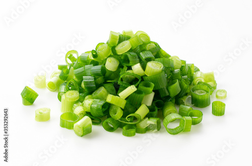 Carved green onions placed on a white background