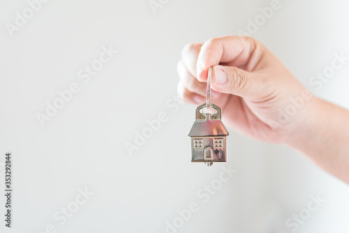 Holding house keys concept, house keys for new house, new house purchase