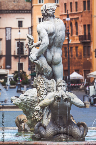 Statues of the fountains of Piazza Navona in the historic center of Rome in Italy. Fontana del Moro in the foreground.