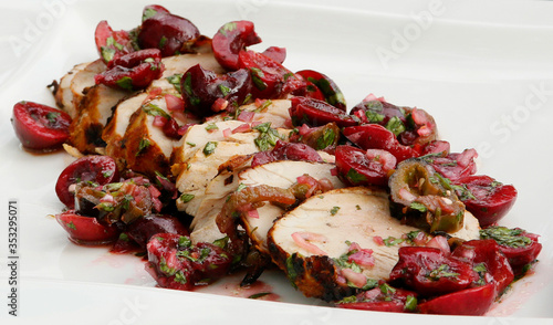 grilled pork topped with a jalapeno, cherry, lime and cilantro