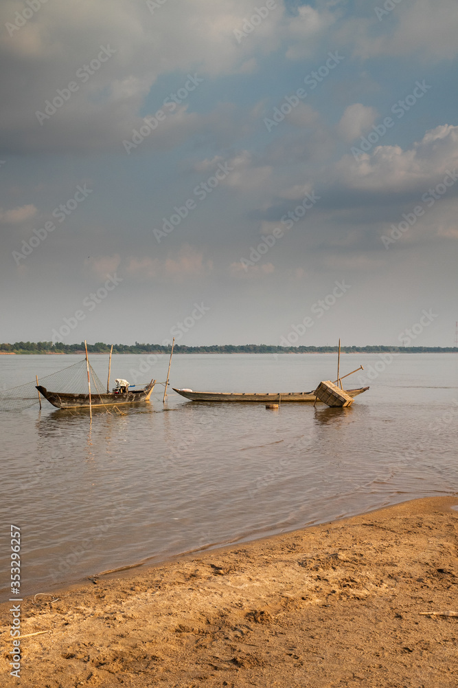 Fototapeta premium boat on Koh Pen (Koh Paen), nice island located in the middle of Mekong river, just off the shore of provincial town of Kampong Cham, Cambodia
