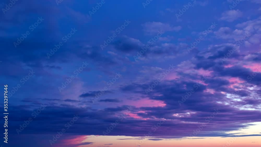 Sunset pink clouds over the sky. Nice skyscape with summer colors. Travel vacation holiday mood. Scenic paradise cloudscape. Timelapse Sunset pink clouds over the sky. Nice skyscape with summer colors. Travel vacation holiday mood. Scenic paradise cloudscape. Timelapse