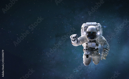 Astronaut in outer space witrh stars. Spaceman. Abstract wallpaper for science background. Elements of this image furnished by NASA 