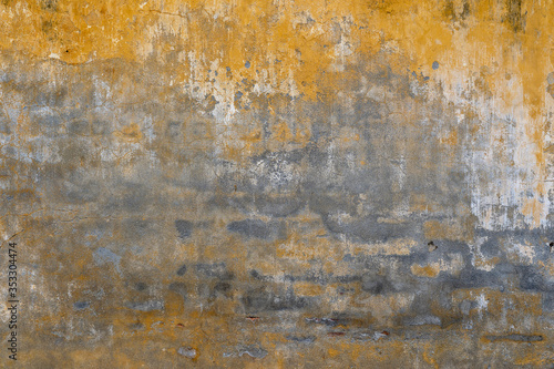 Background of old yellow painted wall texture © OlegD
