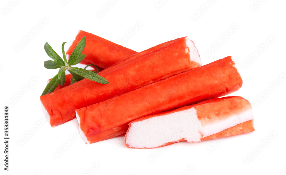 Crab stick isolated on white background. Imitation crab meat with rosemary sprig. Fish product. Crab stick isolated on white background. Imitation crab meat with rosemary sprig. Fish product.