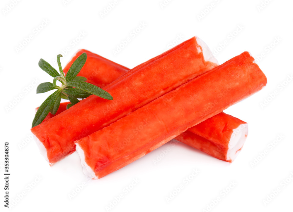 Crab stick isolated on white background. Imitation crab meat with rosemary sprig. Fish product. Crab stick isolated on white background. Imitation crab meat with rosemary sprig. Fish product.