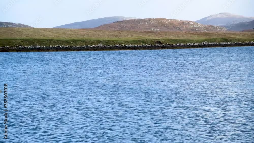 Viewing a Scottish mountain range from across the harbour on Lewis Island in the Outer Hebrides Viewing a Scottish mountain range from across the harbour on Lewis Island in the Outer Hebrides