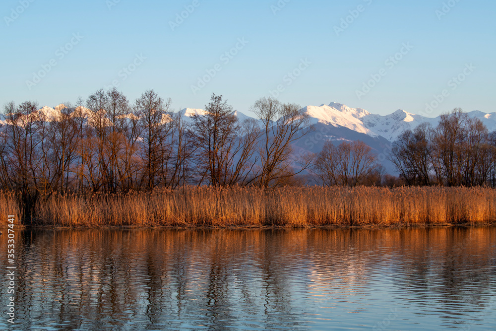 Mountain landscape ove the Fagaras Mountains Sibiu Romania Water reflexion, sunset over the rocks