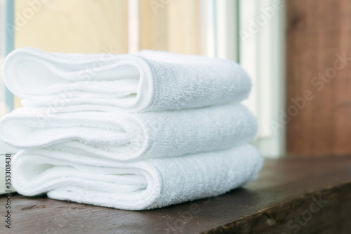 Stacked white spa towels