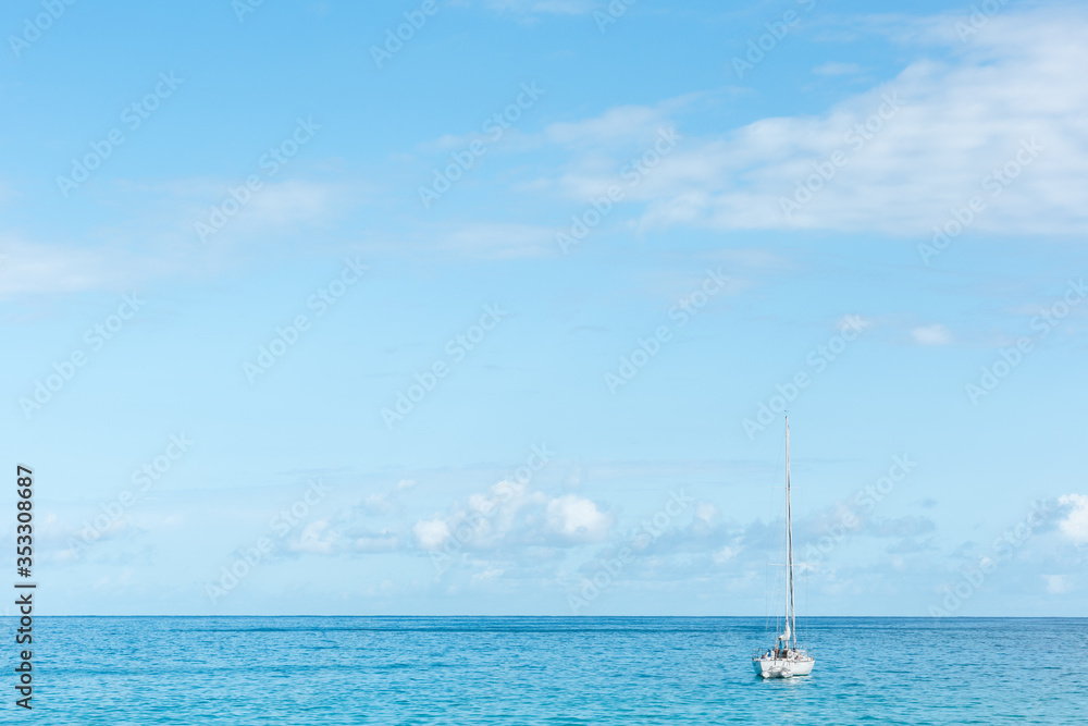 Fototapeta premium Sailboat on the open sea during a sunny summer day.