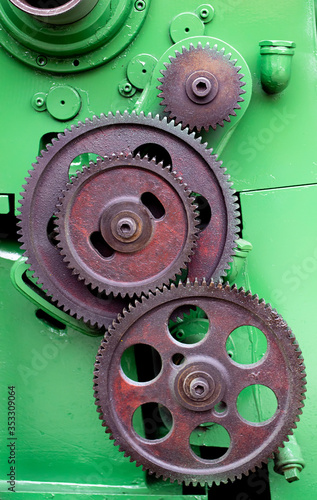 close up  gear modul set on green lathe machine photo