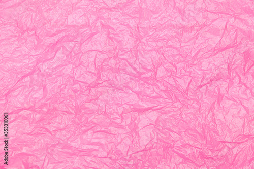 crumpled pink plastic bag texture background surface