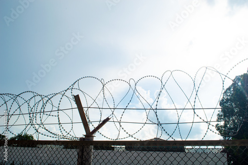 twist barbed wire with blue sky