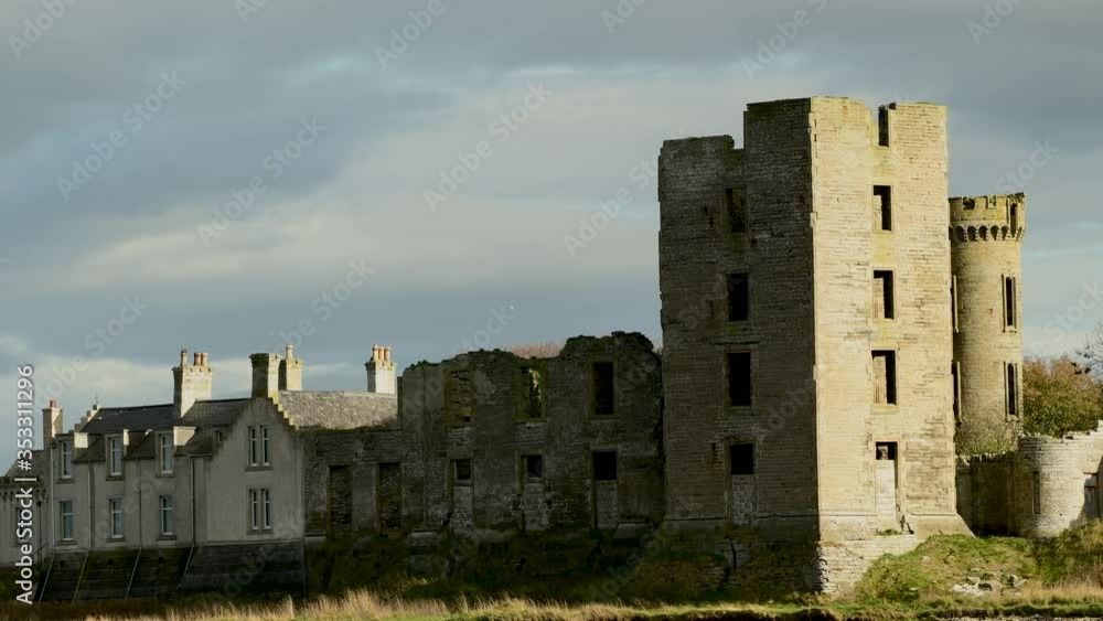 Beachfront castle in Thurso, on the coastline of Scotland Beachfront castle in Thurso, on the coastline of Scotland