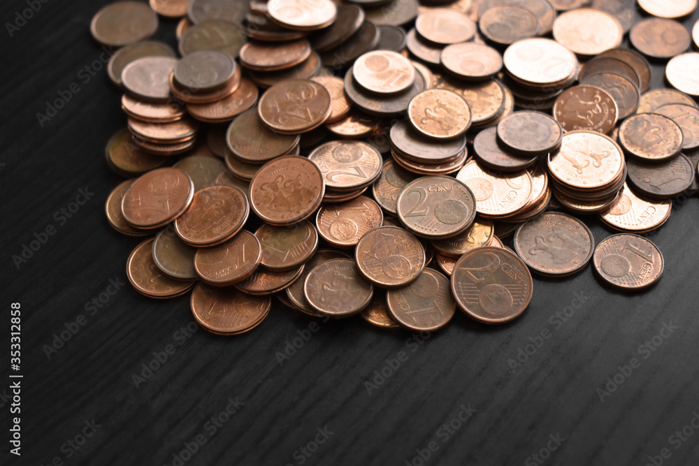 Euro cent coins on wood table. Selective focus. Euro cent coins on wood table. Selective focus.