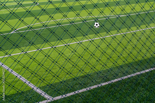 green net fance and Penalty spot soccer football field background