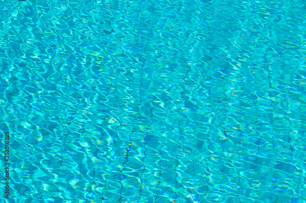 Blue Water sun Reflections on swimming pool  background Texture