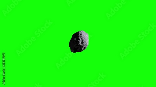 Asteroid flyby on green screen. Asteroid whizzes by camera. photo