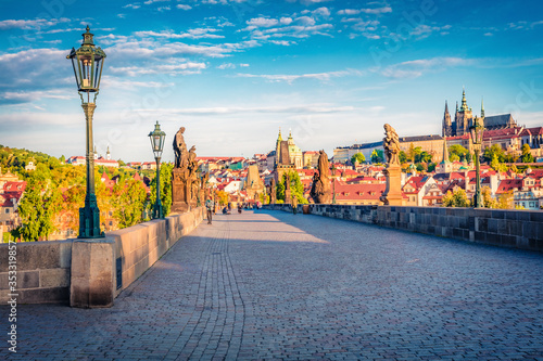 Marvelous morning view of Charles Bridge, Prague Castle and St. Vitus cathedral on Vltava river. Spectacular summer cityscape of Prague, Czech Republic, Europe. Traveling concept background. photo