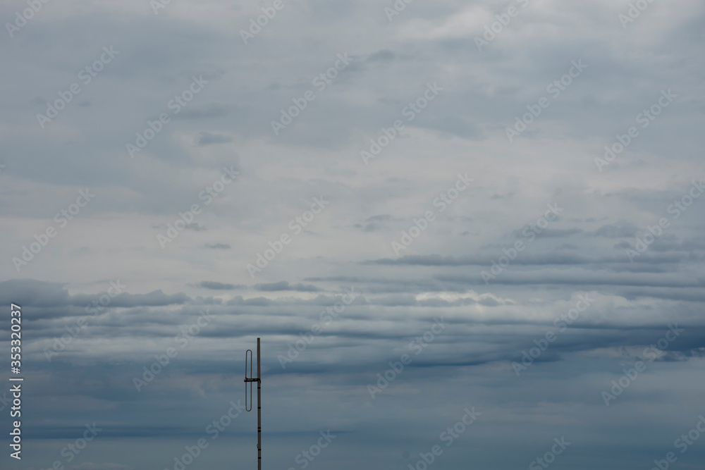 Antenna and background of rain storm cloud, Dark clouds.