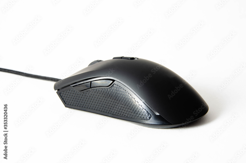 Black gaming mouse with side extra keys and a matte finish on white background. Mouse view from the back under the brush. The mouse in macro, the keys and the wheel are viewed from a person an angle Black gaming mouse with side extra keys and a matte finish on white background. Mouse view from the back under the brush. The mouse in macro, the keys and the wheel are viewed from a person an angle