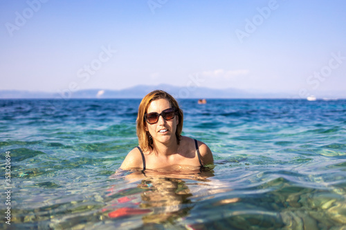 Middle aged woman into the sea