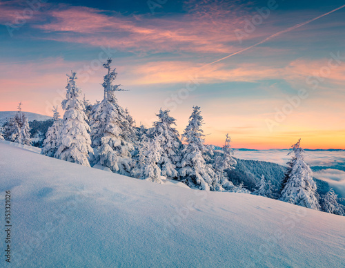 Perfect outdoor scene of winter mountains. Magnificent sunset in Carpathians, Ukraine, Europe. Snowy evening view of mountain valley. Beauty of nature concept background.. © Andrew Mayovskyy