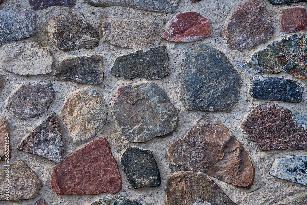 Background masonry made of natural stone. Cement and cobblestones. Background masonry made of natural stone. Cement and cobblestones.